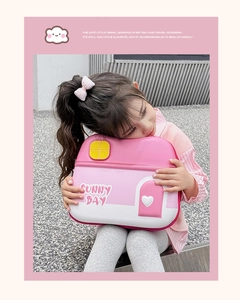 Close-up of pink house-shaped EVA toddler backpack with cute Sunny Day heart details