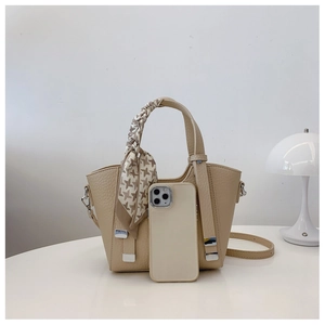Chic beige bucket bag with houndstooth silk scarf and phone for size reference