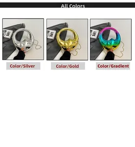 Three variants of moon-shaped acrylic evening bags in gold, silver, and gradient colors