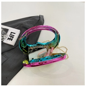 Detailed interior view of gradient rainbow evening bag with metallic chain strap