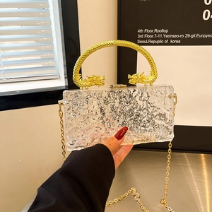 Water ripple acrylic clutch with golden dragon handles and detachable chain strap
