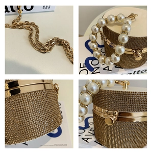 Detailed views of gold rhinestone cylinder clutch featuring pearl handle and metal chain