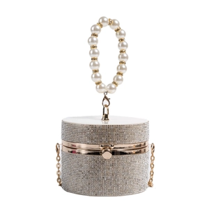 Silver cylindrical evening bag with rhinestones, pearl handle and gold frame