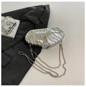 Silver metallic clutch bag with organic wave texture and sleek ball chain detail