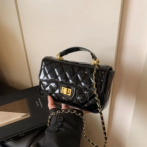 Chic black patent leather quilted handbag with gold hardware and chain strap