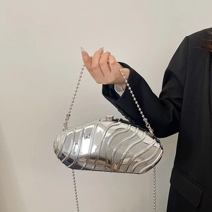 Silver wavy metal clutch bag with a sleek bead chain strap and mirror finish for women