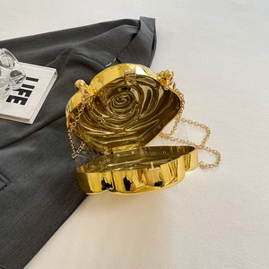 Elegant gold rose shaped evening clutch bag with metallic flower texture and chain
