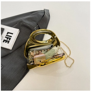 Internal view of gold metallic evening clutch bag showing capacity for phone and cosmetics