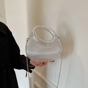Transparent acrylic evening handbag with vertical stripes and golden chain strap