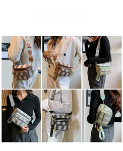 Detailed view of striped crossbody saddle bags with wide geometric pattern shoulder straps