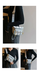 Close-up of light blue checkered crossbody bag with adjustable geometric pattern strap