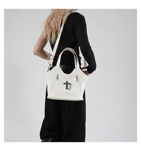 Detailed back view of white cross tote bag with lychee texture and adjustable strap