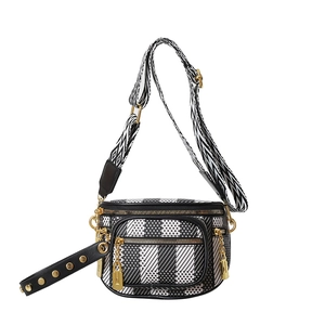 Crossbody bag with black and white checkerboard pattern and wide geometric strap