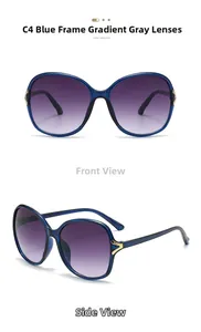 Detail of blue oversized butterfly sunglasses with gradient lenses and gold V hinge