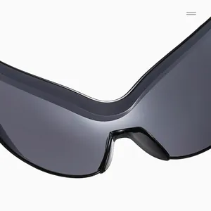 Detail of sleek black wrap-around sunglasses with a futuristic butterfly wing frame design