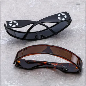 Detail of cyberpunk star emblem on black and tortoise wrap around futuristic sunglasses