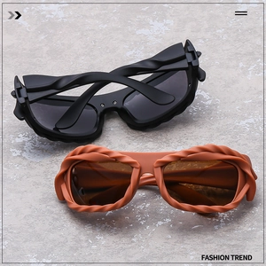 Detail showing the twisted braided frame texture and metal hinge on fashion sunglasses