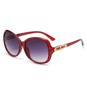 Oversized vintage red sunglasses with gradient purple lenses and gold metal details