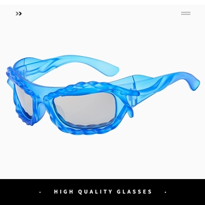 Detailed close-up of blue wavy frame sunglasses with artistic irregular design