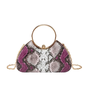 Snake skin pattern evening handbag with gold ring handle and metal chain strap