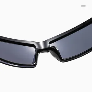Macro view of cyberpunk style black wrap around sunglasses bridge and sleek frame