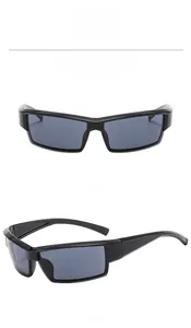 Detail of bright black futuristic cyberpunk sunglasses with gray lenses in dual view