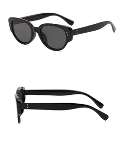 Detailed side and rear views of black cat-eye sunglasses with silver dot accents