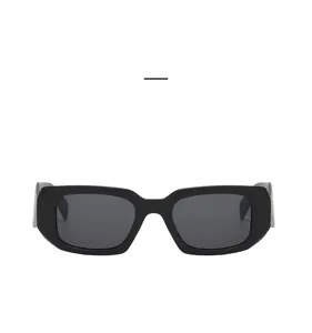 Front view of matte sand black rectangular sunglasses with dark gray lenses