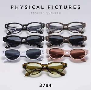 Flat lay of retro cat eye sunglasses in multiple colors and transparent lenses