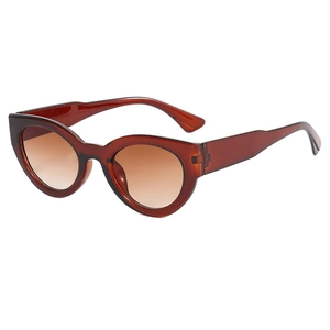Lunettes de soleil œil-de-chat rétro avec monture ambre et verres dégradés bruns
