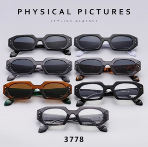 Flat lay of multiple stylish geometric polygon sunglasses in various trendy colors