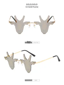 Vue détaillée de lunettes de soleil cerf sans monture avec cadre doré et verres gris