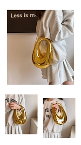 Detailed view of the hollow geometric gold evening bag with high-shine metallic finish