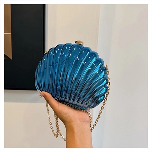 Detail of metallic blue shell-shaped evening clutch bag with gold chain strap