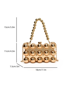 Detailed view of golden metal evening clutch with beaded handle and size dimensions