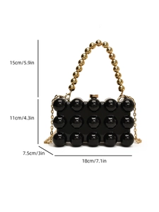 Detailed size chart of black acrylic shell clutch bag with dimensions in cm and inches