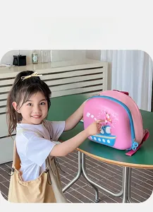 Detail of pink children backpack featuring a 360-degree rotating windmill and dog design