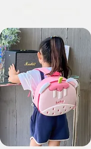 Detail of a lightweight pink strawberry dessert-shaped backpack for preschool children
