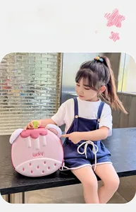 Detail of pink strawberry cupcake EVA hardshell backpack for toddlers with lucky lettering