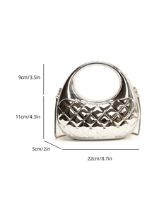 Detailed view of silver quilted acrylic box bag with 3D diamond pattern and studs