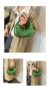 Detail view of emerald green quilted acrylic clutch with metallic finish and round handle