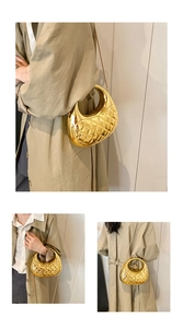 Detailed view of golden hobo bag with quilted rhombus pattern and circular top handle