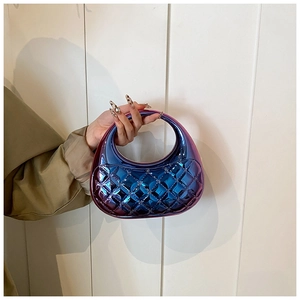 Detail of gradient blue-purple quilted semi-circle handbag with metallic finish
