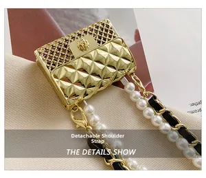 Detail of mini quilted gold bag with floral clasp and detachable pearl chain strap