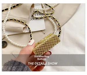 Detail shot of the wear-resistant gold mesh bottom and elegant pearl chain strap