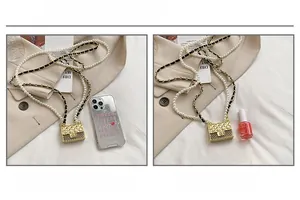 Mini gold quilted crossbody bag size comparison with a smartphone and pearl chain detail