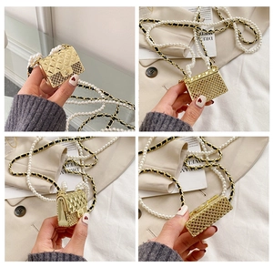 Detailed views of a gold quilted mini bag with pearl metal chain strap and grid pattern