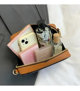 Interior storage view of the retro cassette crossbody bag showing capacity for daily essentials