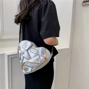 Silver heart-shaped biker jacket shoulder bag with zipper and stud details for women