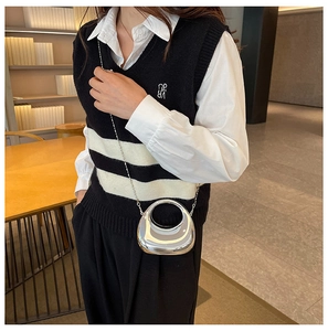 Detail of silver mirror mini crossbody bag with round handle and bead chain strap